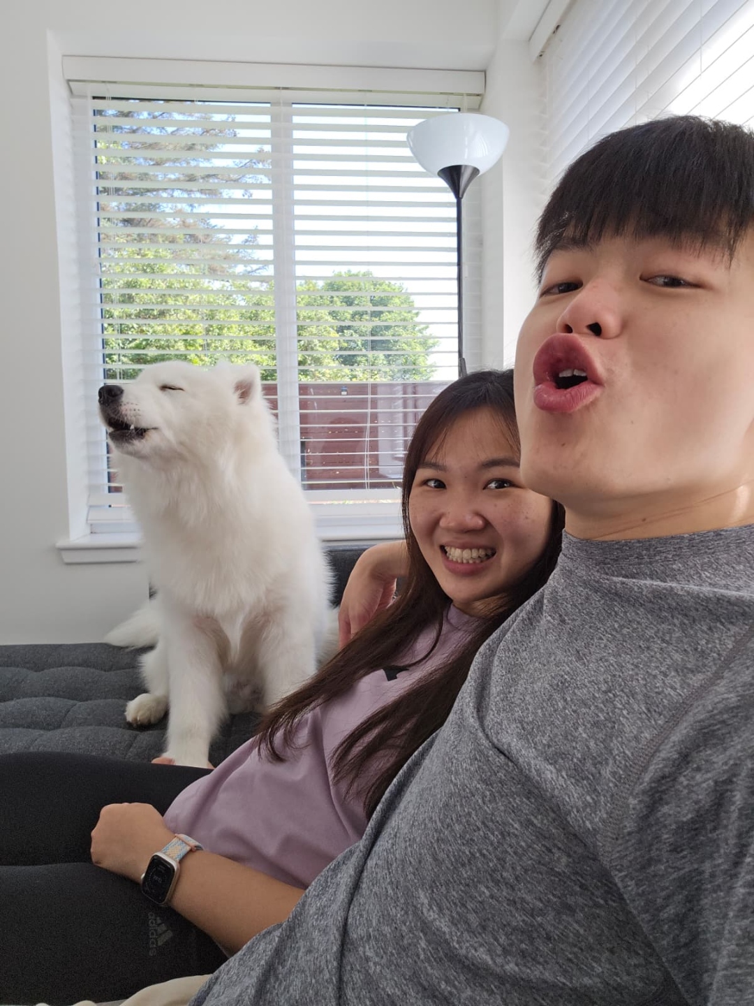 Yi Lin and Yu En with their Samoyed